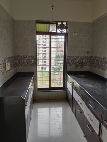 Kitchen in 1 BHK Apartment at Raunak City Sector 4, Kalyan West – for Sale
