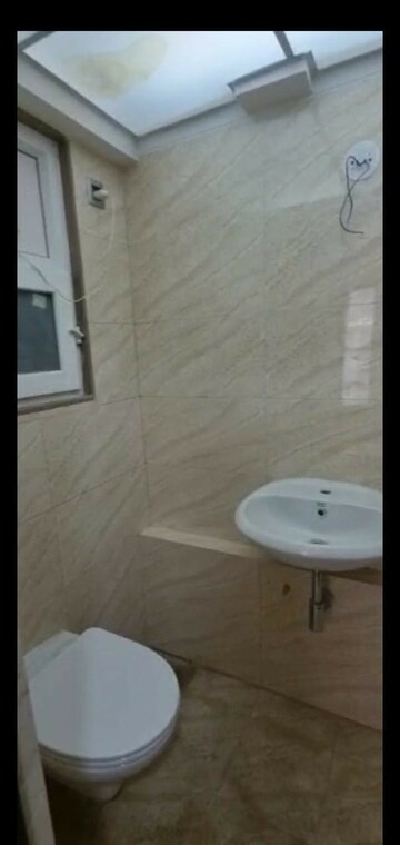 Bathroom in 2 BHK Apartment at Tilak Nagar – for Rent