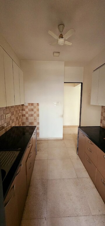 Kitchen in 2 BHK Apartment at Divine Aspen Garden, Goregaon East – for Sale