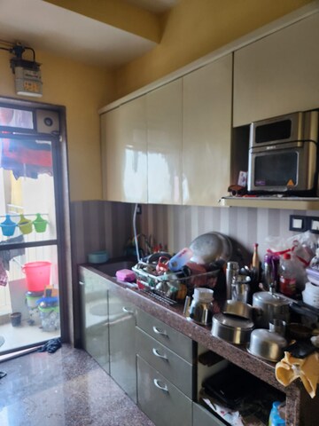 Kitchen in 3 BHK Apartment at Kalpataru Sunrise Grande, Kolshet Road – for Sale