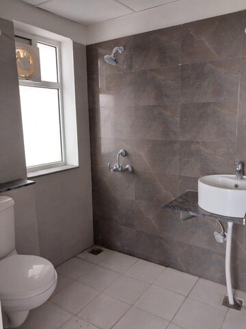 Bathroom in 3 BHK Apartment at Paradigm Business Hermitage Park, Dhakoli Village – for Sale