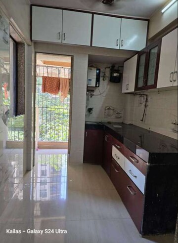 Kitchen in 1 BHK Apartment at Soham Parijat Gardens, Ghodbunder Road – for Sale