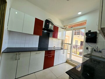 Kitchen in 2 BHK Apartment at Green Valley Heights, Dhakoli Village – for Sale