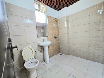 Bathroom in 2 BHK Apartment at Green Valley Heights, Dhakoli Village – for Sale