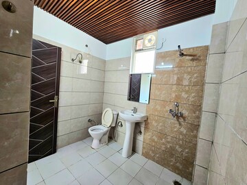 Bathroom in 2 BHK Apartment at Green Valley Heights, Dhakoli Village – for Sale