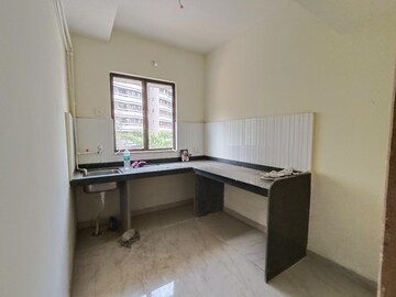 Kitchen in 1 BHK Apartment at Rustomjee Global City – for Sale