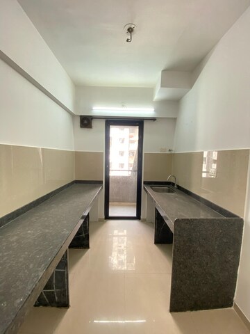 Kitchen in 1 BHK Apartment at Lodha Palava Eviva K To T Urbano A C F and I To T, Dombivli East – for Rent