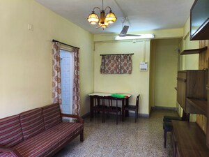 Living Room in 1 BHK Apartment at New Rajendra Apartment CHS, Mahim – for Rent