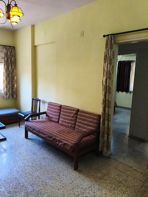 Living Room in 1 BHK Apartment at New Rajendra Apartment CHS, Mahim – for Rent