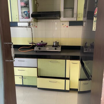 Kitchen in 2 BHK Apartment at Satellite Garden, Umershetpada – for Sale