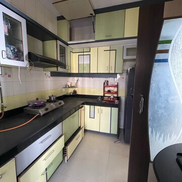 Kitchen in 2 BHK Apartment at Satellite Garden, Umershetpada – for Sale