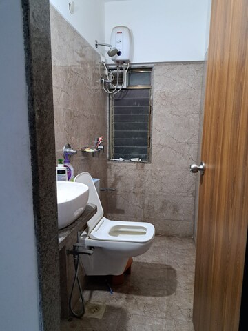 Bathroom in 1 BHK Builder Floor at Parinee Essence, Kandivali West – for Sale