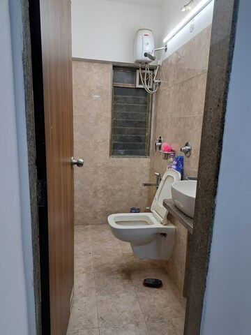 Bathroom in 1 BHK Builder Floor at Parinee Essence, Kandivali West – for Sale