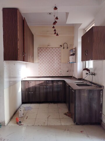 Kitchen in 2.5 BHK Apartment at Amrapali Princely Estate, Sector 76 – for Sale