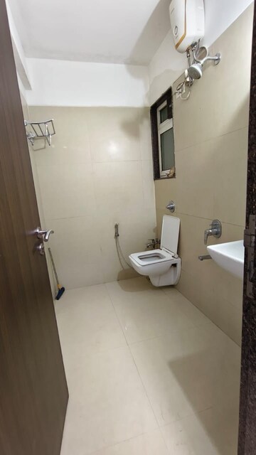 Bathroom in 2 BHK Apartment at Puranik Rumah Bali, Ghodbunder Road – for Rent
