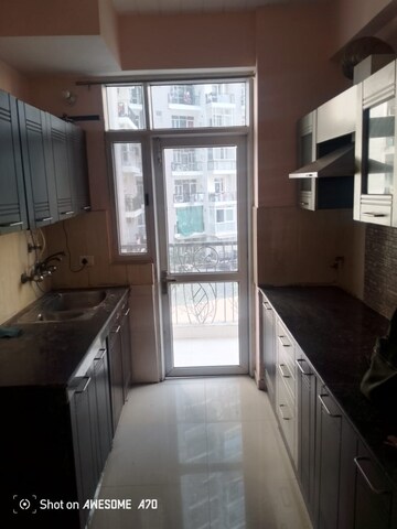 Kitchen in 3 BHK Apartment at Mahagun Mezzaria, Sector 78 – for Rent