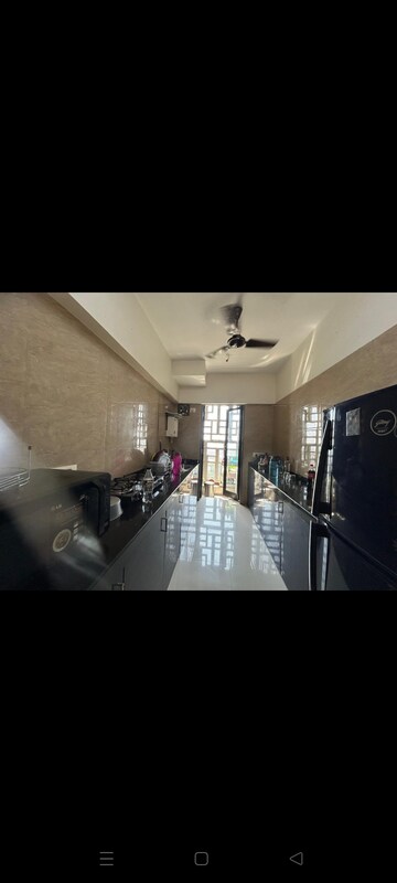 Kitchen in 3 BHK Apartment at Om Hillcrest, Parel – for Rent