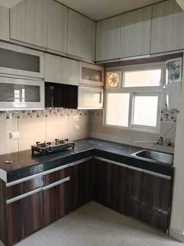 Kitchen in 2 BHK Apartment at Signature Orchard Avenue 2, Sector 93 – for Rent