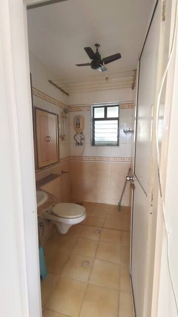 Bathroom in 2 BHK Apartment at Jasmine Tower, Vasant Vihar – for Rent