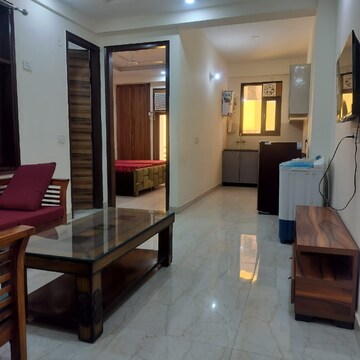 Living Room in 2 BHK Apartment at Palm Residency Chhatarpur, Rajpur Khurd Extension – for Rent