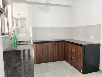 Kitchen in 2 BHK Apartment at Rodas Enclave Woodstock, Patlipada – for Rent