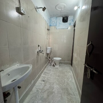 Bathroom in 2 BHK Apartment at Palm Residency Chhatarpur, Rajpur Khurd Extension – for Rent
