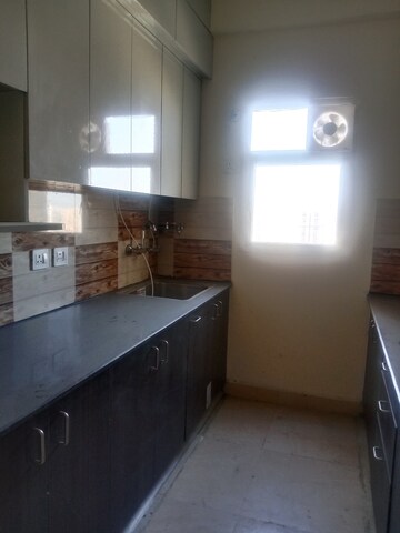 Kitchen in 3 BHK Apartment at Amrapali Dream Valley, Tech Zone 4 Greater Noida – for Rent