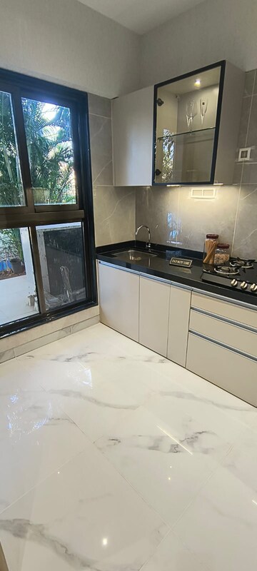 Kitchen in 2 BHK Apartment at MICL Aaradhya Parkwood, Mira Road – for Sale