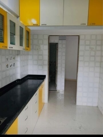 Kitchen in 1 BHK Apartment at Raunak Delight, Owale – for Rent