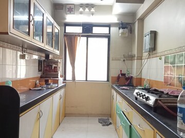 Kitchen in 2 BHK Apartment at Lodha Paradise, Majiwada – for Rent