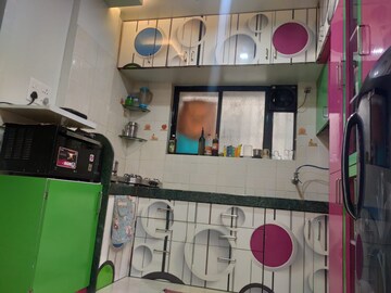 Kitchen in 2 BHK Apartment at Samarth Puram CHS, Shivane – for Sale