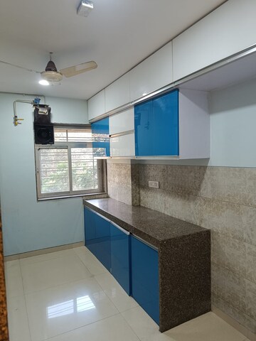 Kitchen in 2.5 BHK Apartment at Neelkanth Greens, Manpada – for Sale