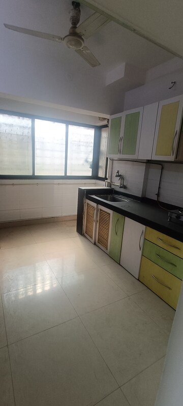 Kitchen in 3 BHK Apartment at Soham Garden, Manpada – for Rent