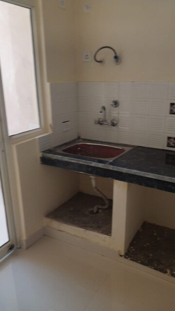 Kitchen in 1 BHK Apartment at Eureka Diya Green City, Raj Nagar Extension – for Sale