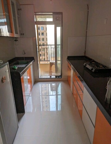 Kitchen in 2 BHK Apartment at Rustomjee Urbania Azziano, Majiwada – for Rent