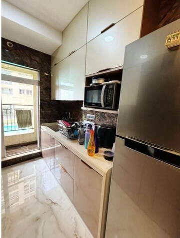 Kitchen in 2 BHK Apartment at Rustomjee Urbania Azziano, Majiwada – for Rent