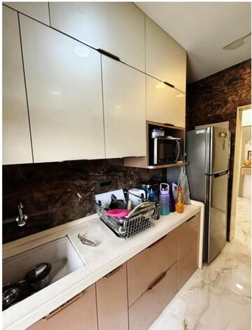 Kitchen in 2 BHK Apartment at Rustomjee Urbania Azziano, Majiwada – for Rent