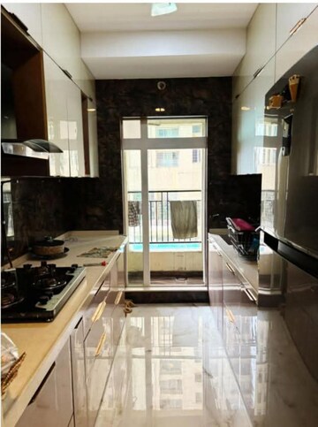 Kitchen in 2 BHK Apartment at Rustomjee Urbania Azziano, Majiwada – for Rent