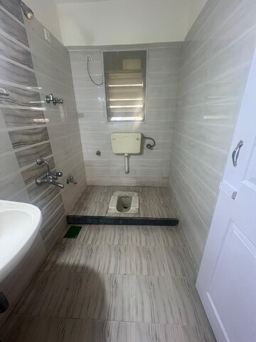 Bathroom in 2 BHK Apartment at Om Sai Charan CHS, Borivali West – for Rent