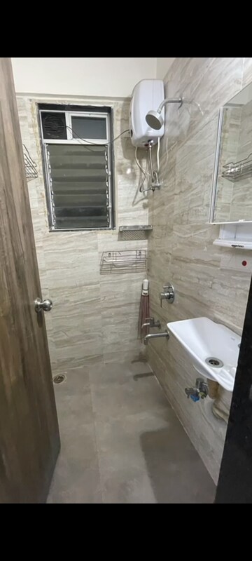 Bathroom in 1 BHK Apartment at Squarefeet Joy square, Kasarvadavali – for Rent