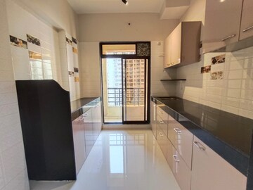 Kitchen in 2 BHK Apartment at Rustomjee Global City – for Sale
