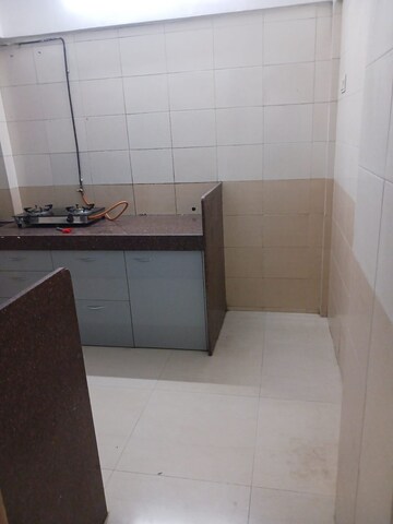 Kitchen in 2 BHK Apartment at Shanti Gardens , Mira Road – for Rent
