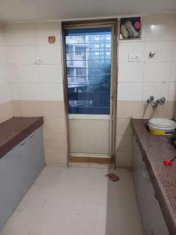 Kitchen in 2 BHK Apartment at Shanti Gardens , Mira Road – for Rent