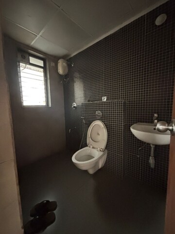 Bathroom in 1 BHK Apartment at Lodha Lakeshore Greens, Dombivli East – for Rent