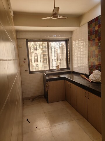 Kitchen in 1 BHK Apartment at Yasmin Tower, Agripada – for Sale