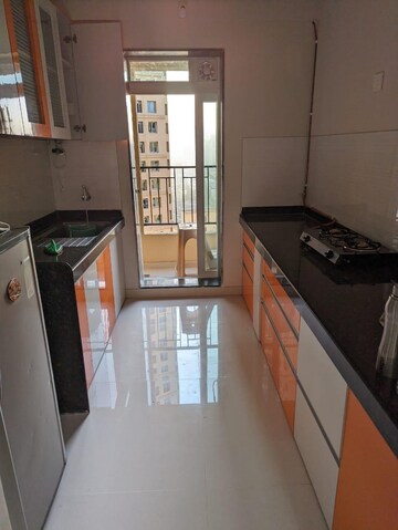 Kitchen in 2 BHK Apartment at Rustomjee Urbania Azziano, Majiwada – for Rent