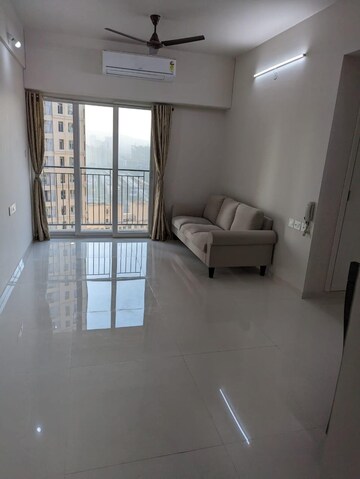 Living Room in 2 BHK Apartment at Rustomjee Urbania Azziano, Majiwada – for Rent