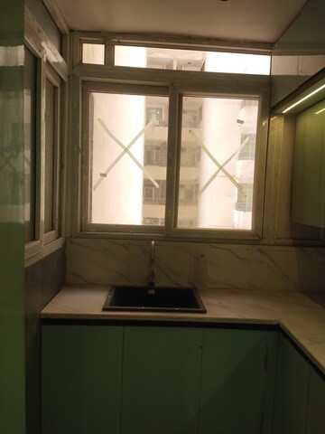 Kitchen in 2 BHK Apartment at Amrapali Golf Homes, Sector 4, Greater Noida – for Rent
