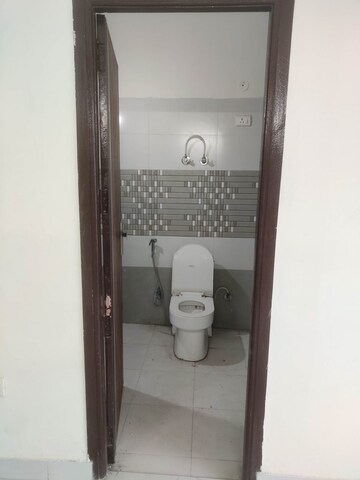 Bathroom in 2 BHK Apartment at Raj Nagar Extension – for Sale