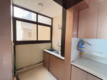 Kitchen in 3 BHK Apartment at Amrapali Golf Homes, Sector 4, Greater Noida – for Rent
